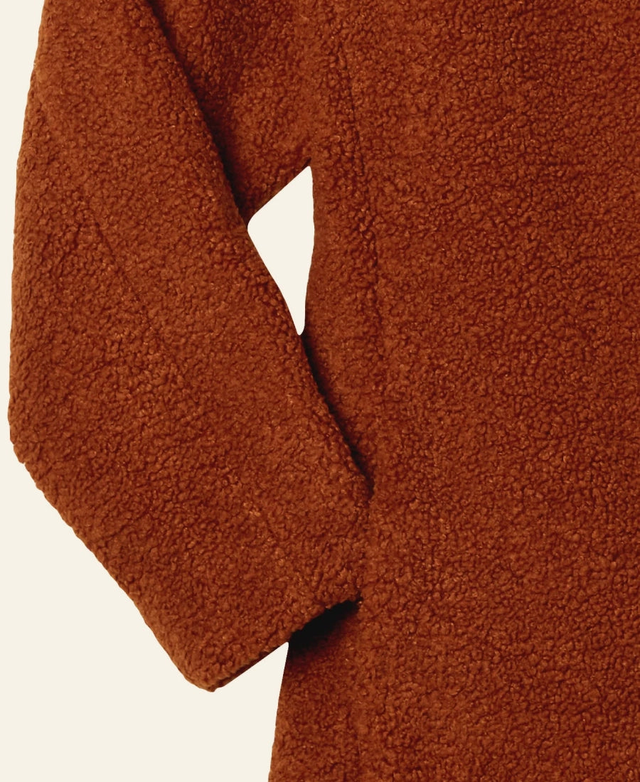 Close-up of a Orange textured fabric with a white background