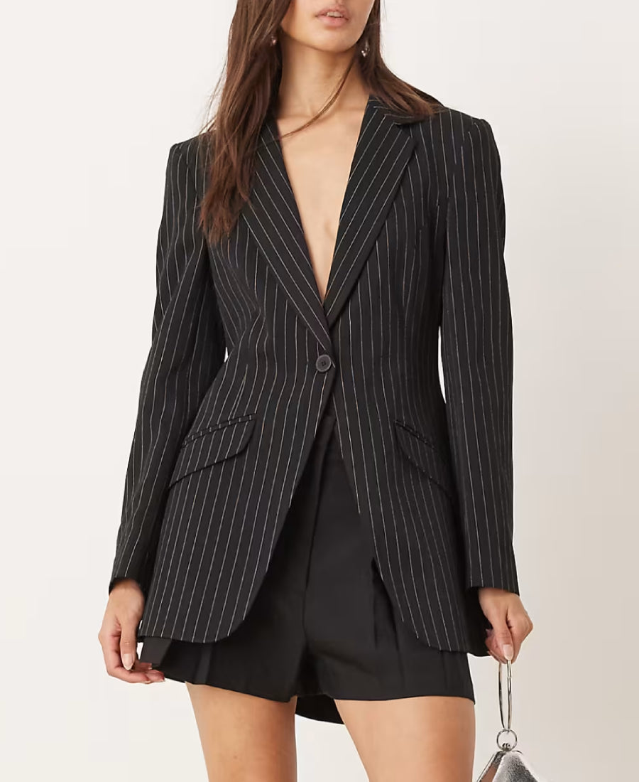 Beth dutton Season 5 black  blazer over a black dress on a white background