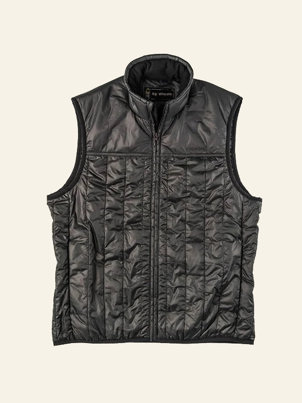 Jamie Dutton Yellowstone Black quilted vest on a beige background front side