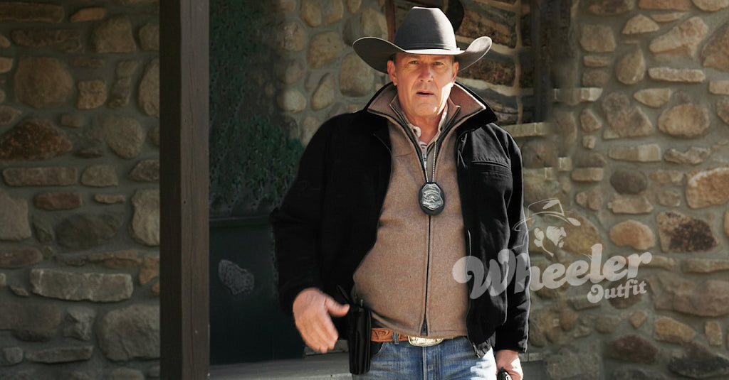 Man wearing a cowboy hat and leather jacket with 'john dutton black cotton jacket' branding in front of a stone wall.