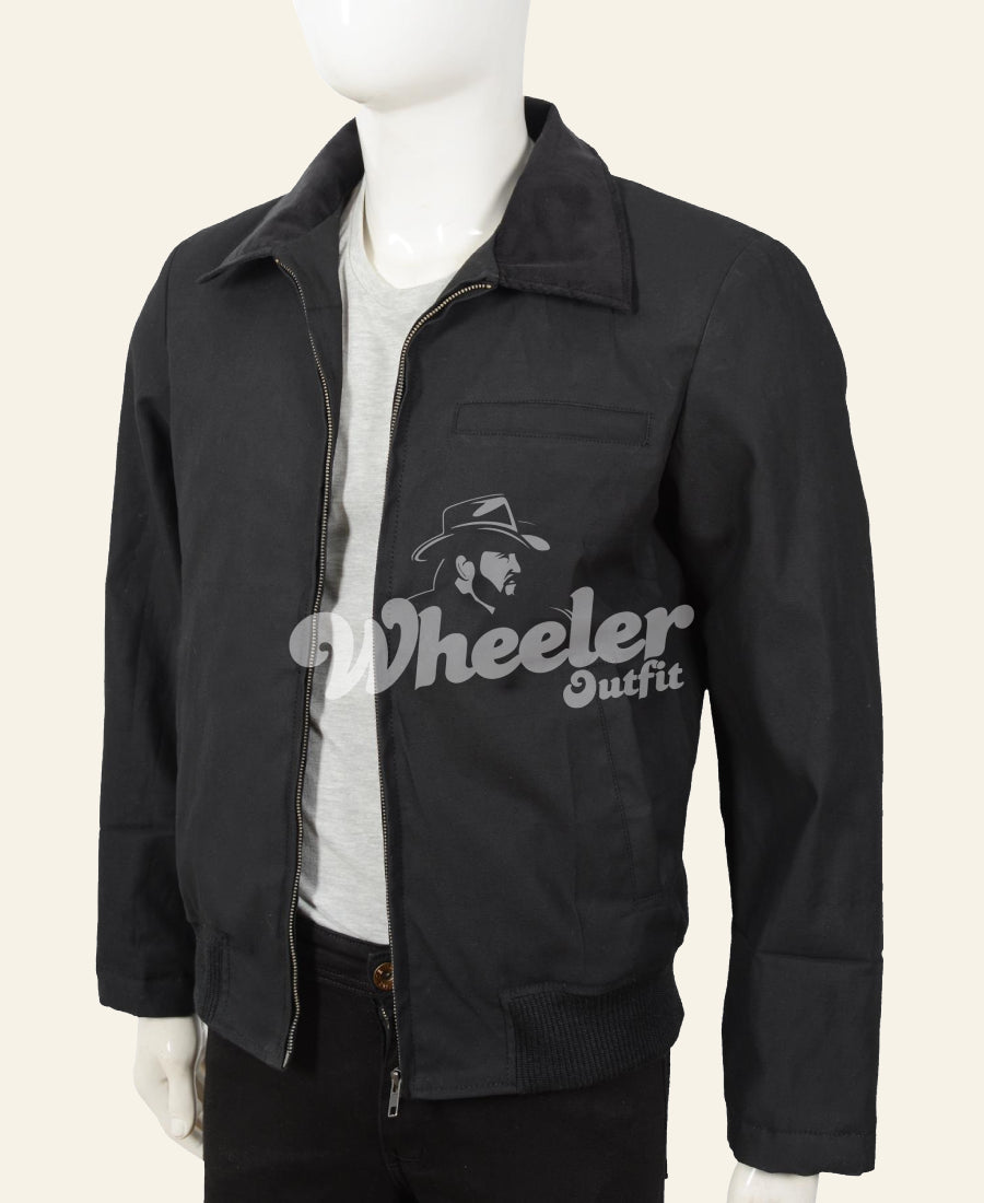 Black jacket with 'john dutton black cotton yellowstone' logo on a mannequin against  Front image