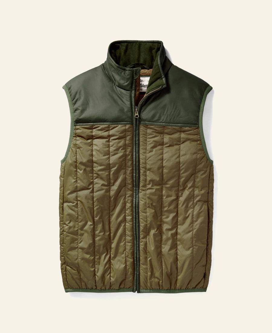 Rip Wheeler Green and brown quilted vest on a light beige background