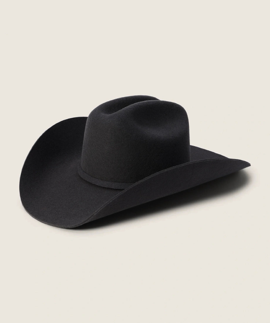 Black cowboy hat rip wheeler on a beige background