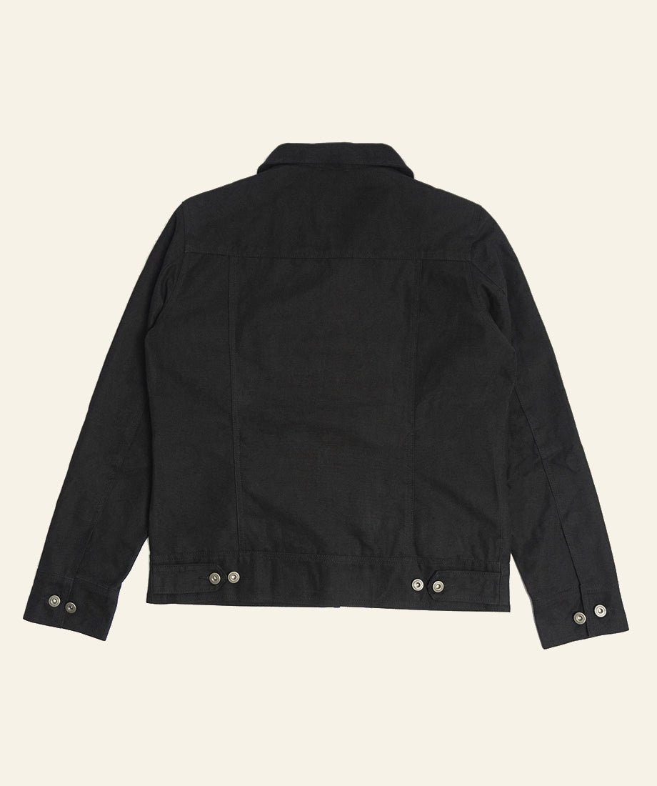 Rip Wheeler Black jacket back view on a beige background