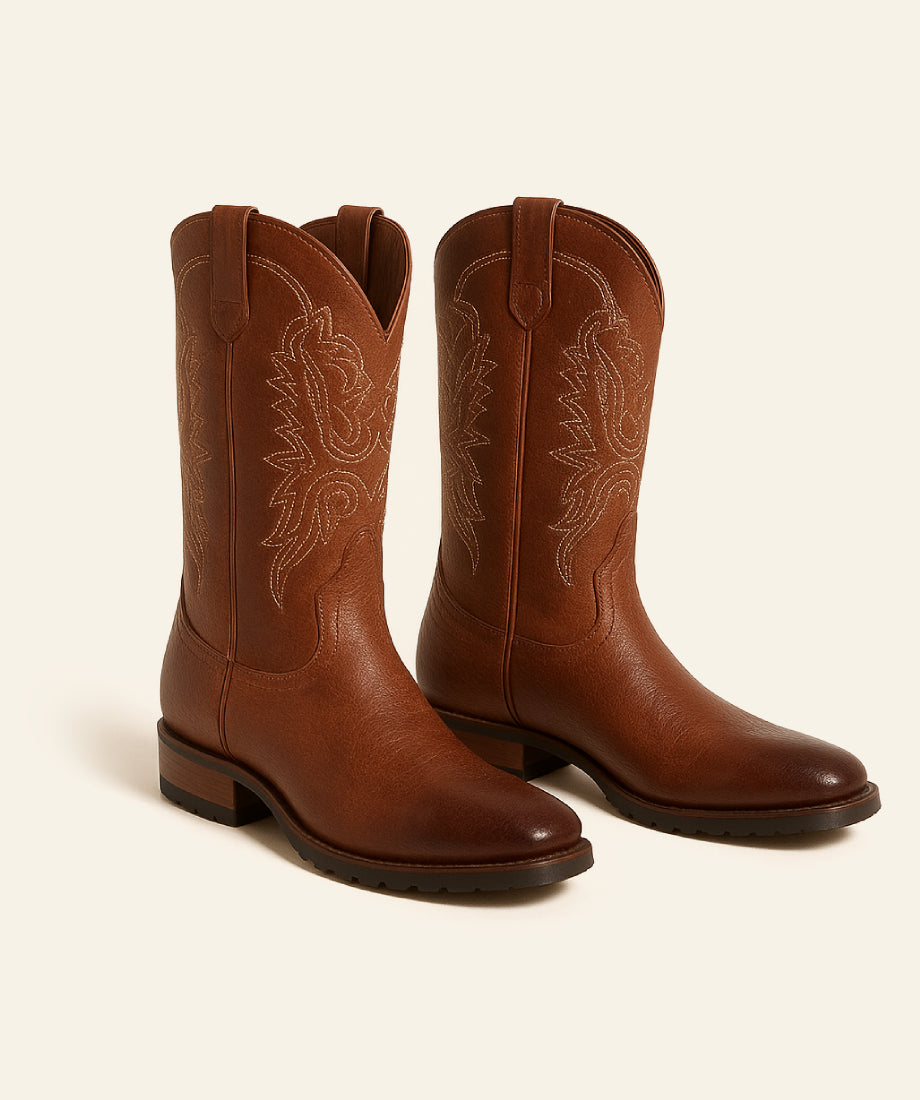 Pair of brown cowboy boots with intricate designs From yellowstone and leather cow boy 