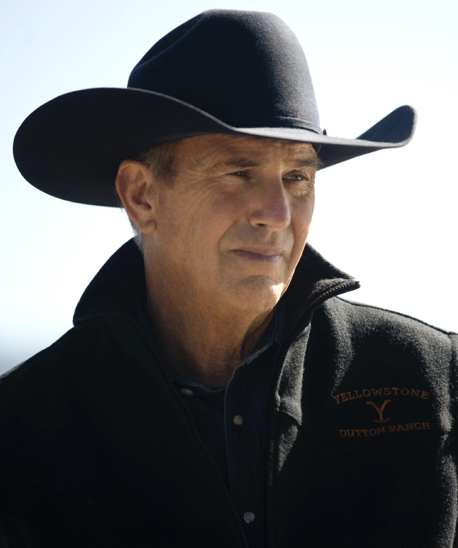 Man wearing a cowboy hat and a jacket with 'Yellowstone john dutton' branding.