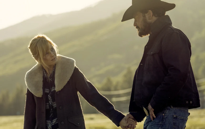 beth and rip wheeler in yellowstone beth wear a brown wool coat and rip wear a black cotton jacket with hat