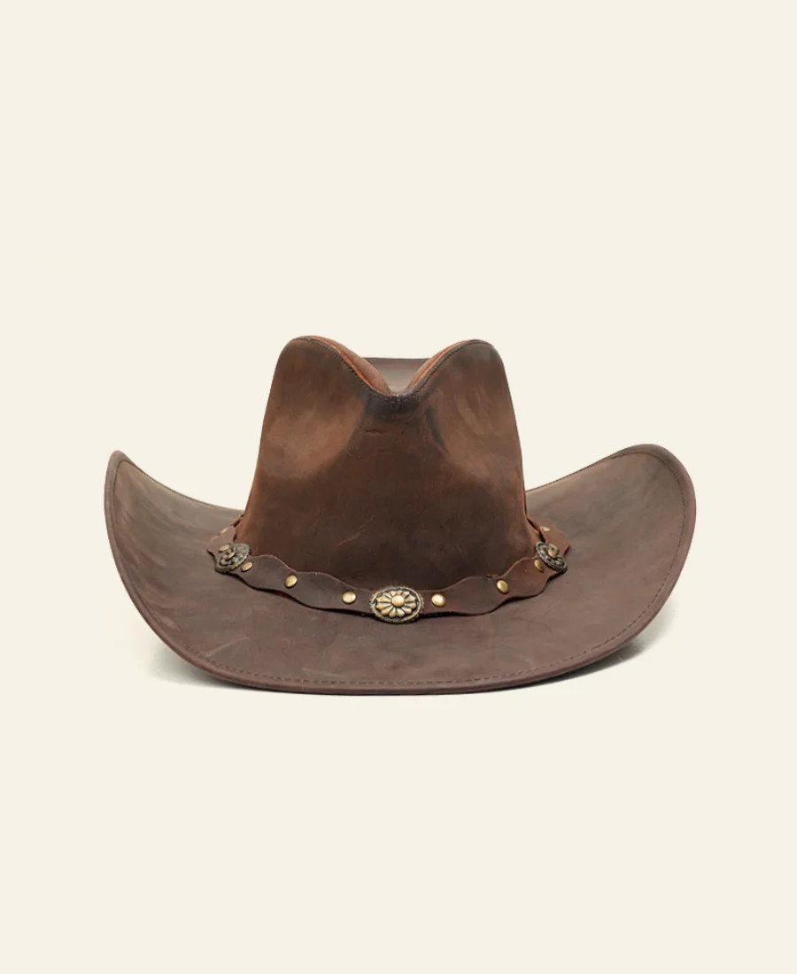 Brown leather cowboy hat with decorative band on a beige background