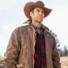 Jamie Dutton wearing a brown cowboy hat and Leather jacket