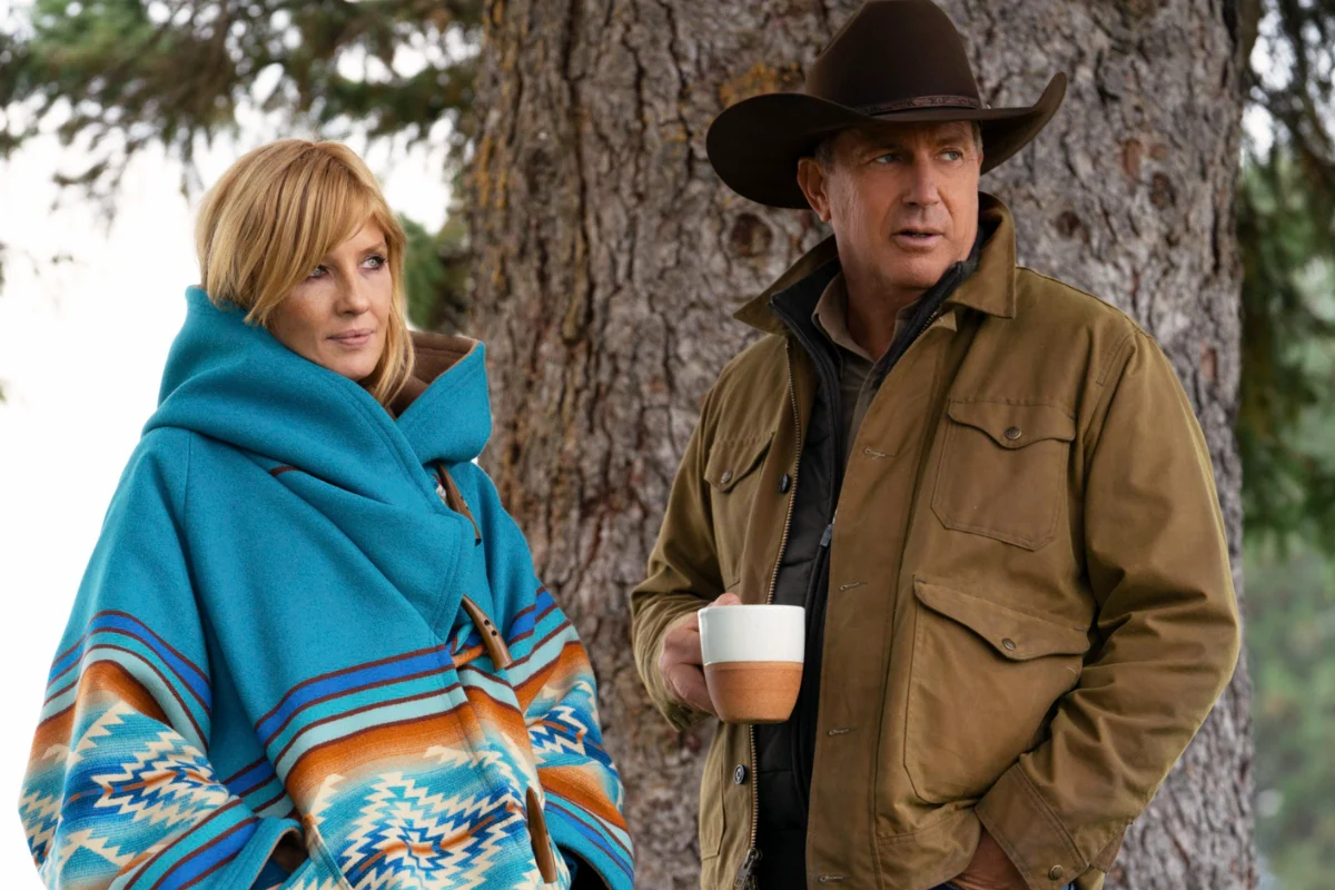 beth and john beth wear a blue coat and john wear a brown cotton jacket in yellowstone moive