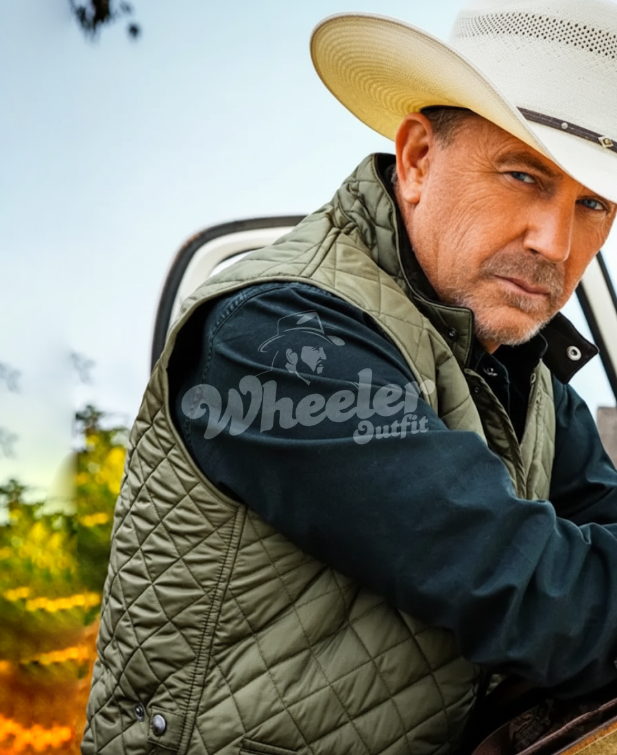 john dutton green quilted vest yellowstone Man wearing a quilted vest with 'john duttont' branding, sitting outdoors.