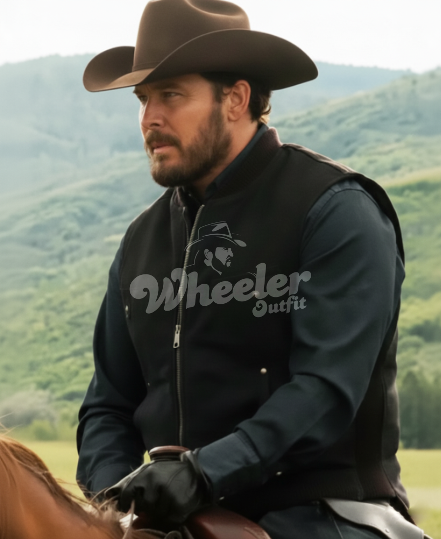 black wool Man wearing a black 'Wheeler Outfit' jacket with a cowboy hat and gloves, standing in a scenic outdoor setting.