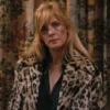 ABeth Dutton wearing a leopard print coat in a room with patterned curtains