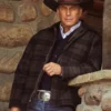 Man wearing a plaid jacket, cowboy hat, and jeans Yellowstone john dutton.