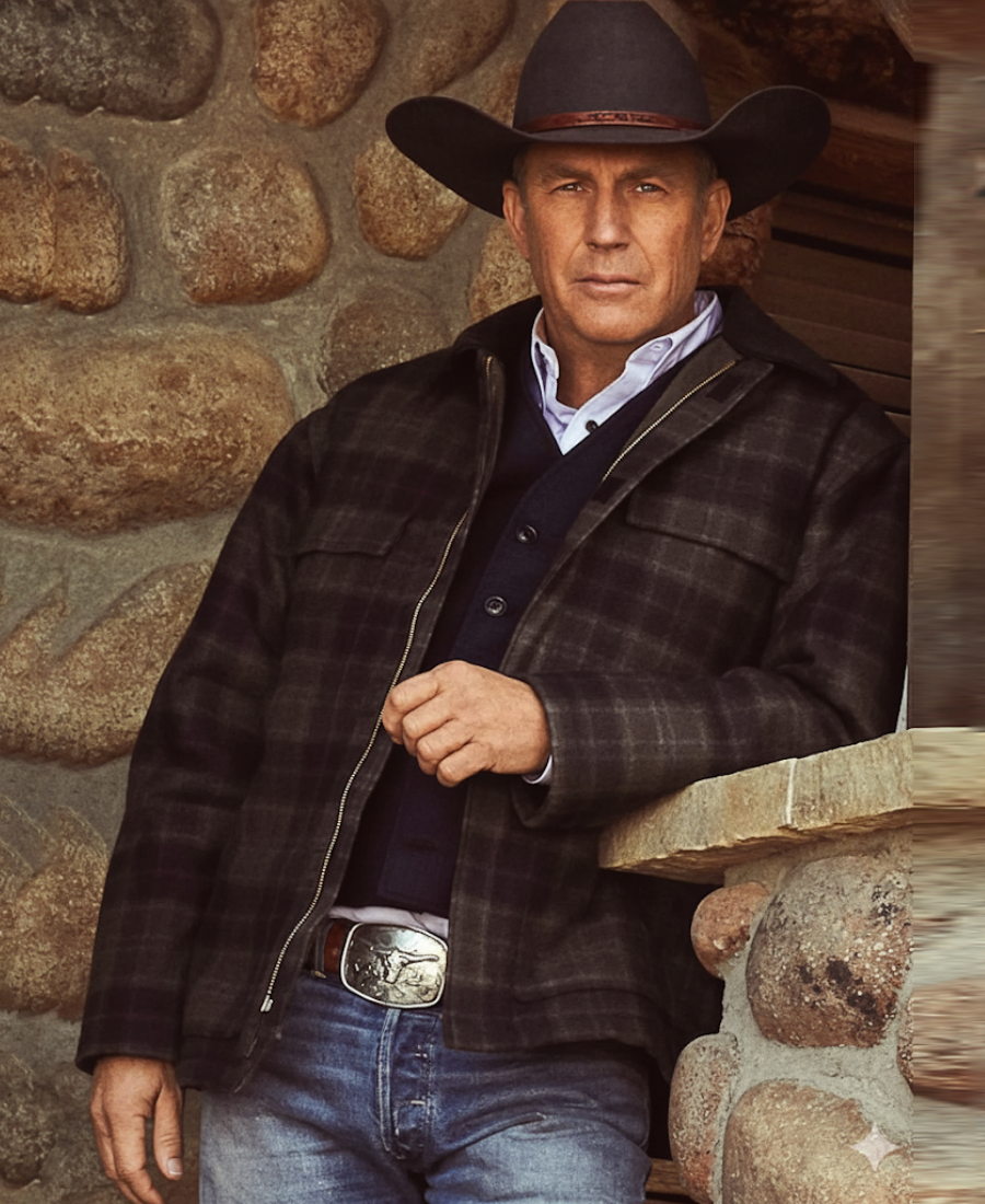 Man wearing a plaid jacket, cowboy hat, and jeans Yellowstone john dutton.