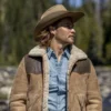 Kayce Dutton wearing a Suede Leather Brown jacket with shearling collar and a cowboy hat..