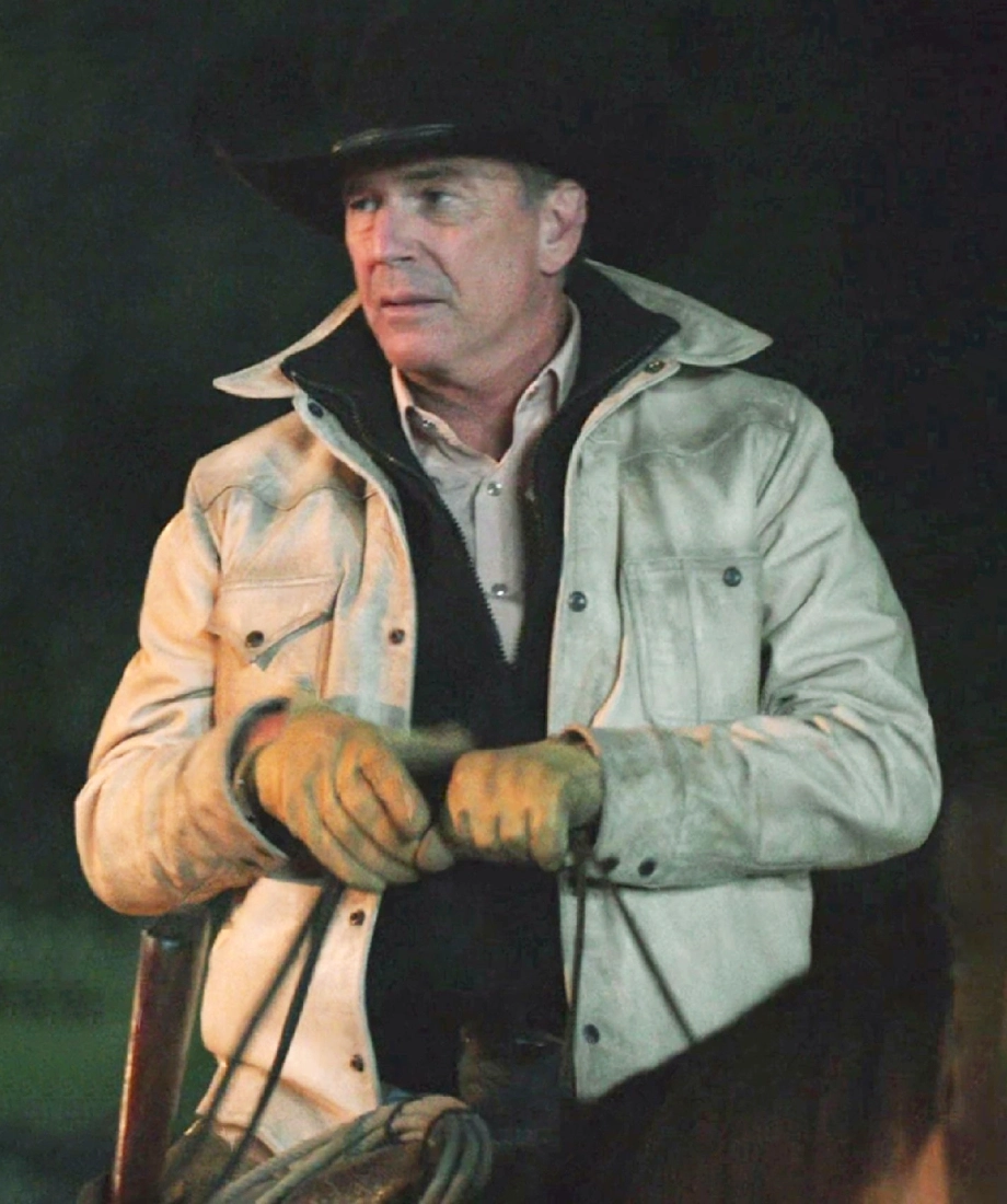 John in a beige jacket and cowboy hat holding a rifle yellowstone john dutton white leather jacket
